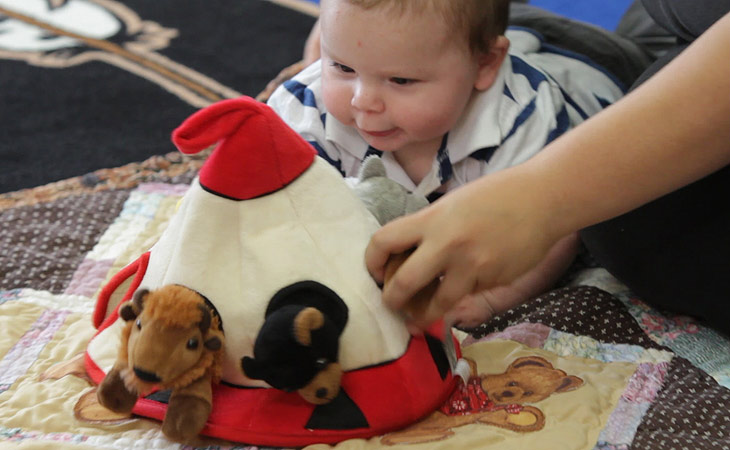 Baby playing with Teepee