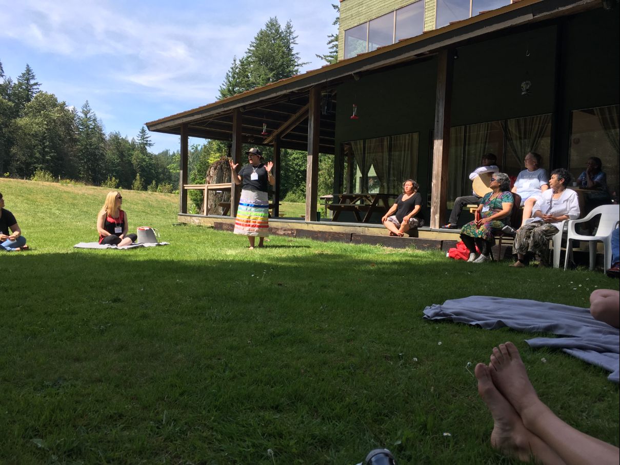 Outdoors in a group at the cultural gathering