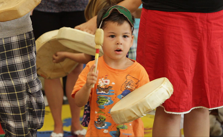 Young Child Playing Drum