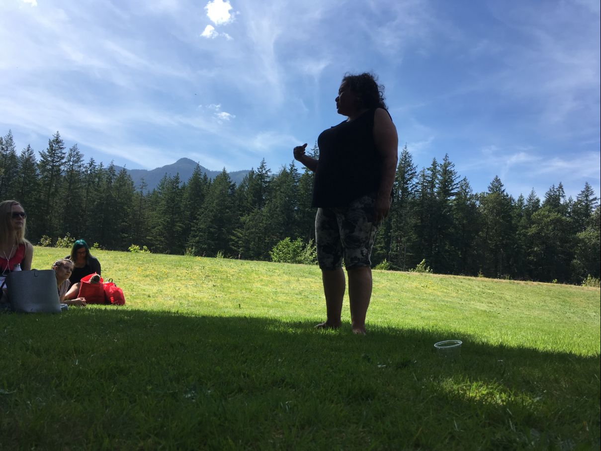 individual speaking outside at the cultural gathering