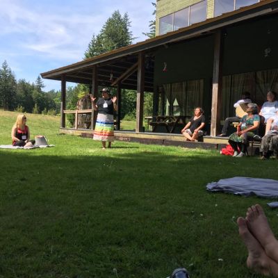 Outdoors in a group at the cultural gathering